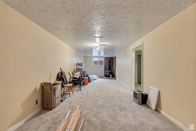 10551 Violet Dr, Sandy, UT 84094 - basement featuring carpet flooring, a textured ceiling, and a wood stove