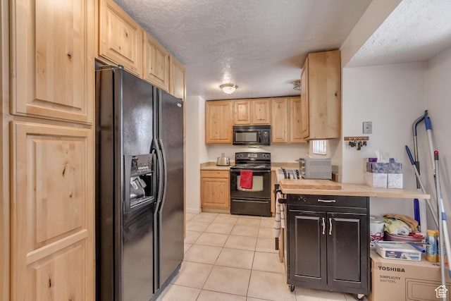 10551 Violet Dr, Sandy, UT 84094 - kitchen with black appliances, light brown cabinetry, light countertops, light tile patterned floors, and a textured ceiling