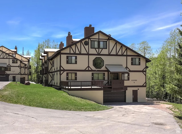 view of front of house with a front yard and a garage