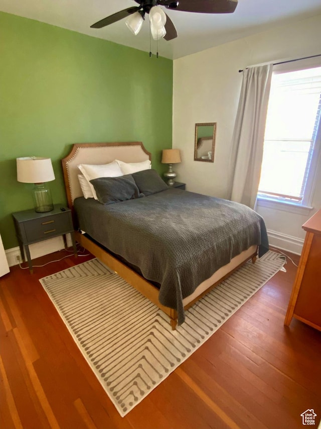 931 E Laird Ave S, Salt Lake City, UT 84105 - bedroom with baseboards, a ceiling fan, and wood finished floors