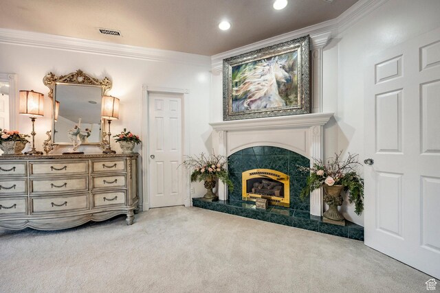 living area with a high end fireplace, ornamental molding, light carpet, and visible vents