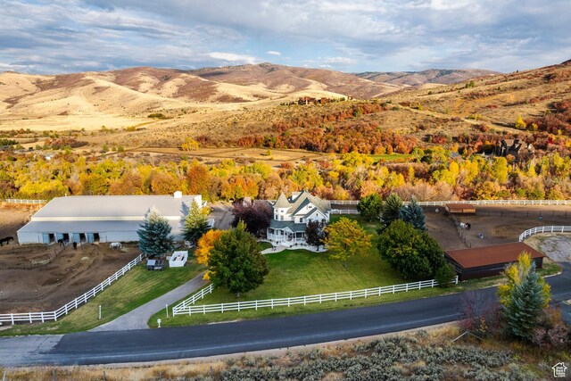 aerial view featuring a rural view and a mountain view