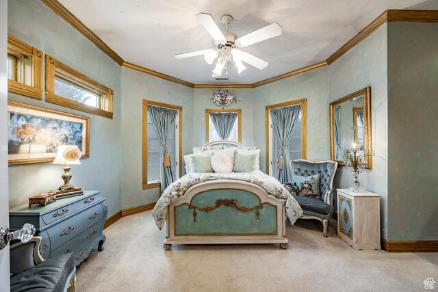 bedroom featuring crown molding, baseboards, ceiling fan, and light colored carpet