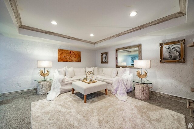 living area with recessed lighting, carpet flooring, a textured wall, and ornamental molding