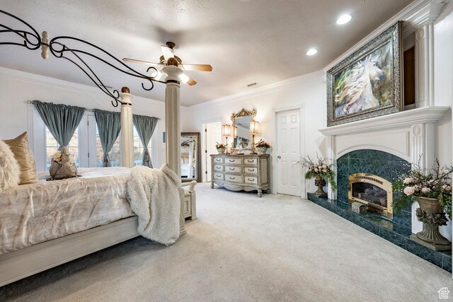 bedroom with crown molding, recessed lighting, carpet, and a high end fireplace