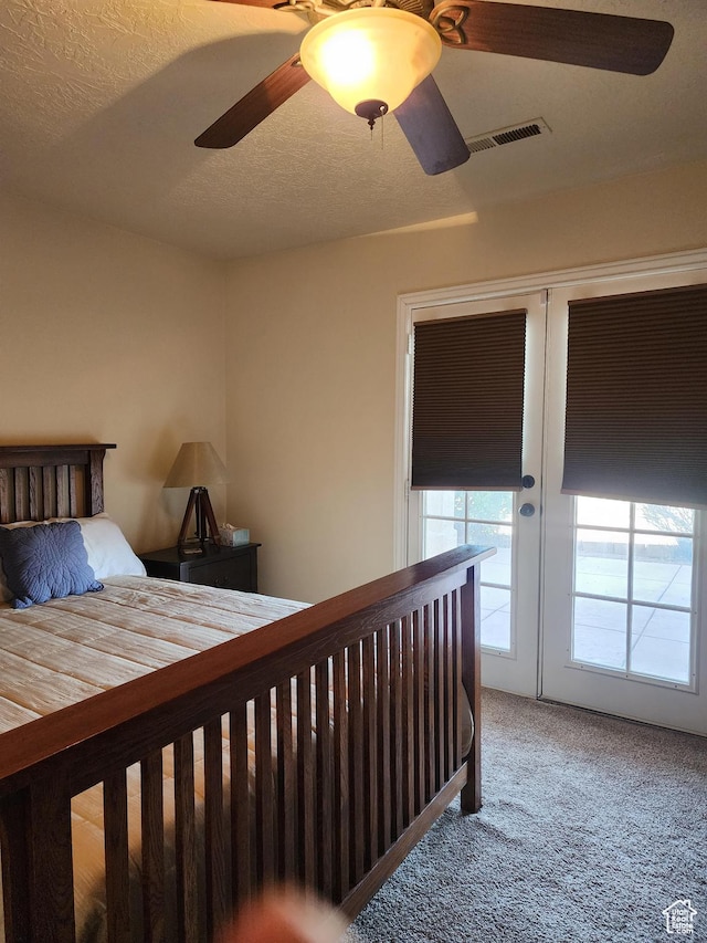804 W Obsidian Dr S, St George, UT 84770 - carpeted bedroom with visible vents, a textured ceiling, and ceiling fan