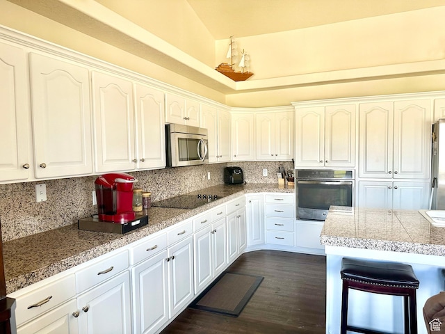 804 W Obsidian Dr S, St George, UT 84770 - kitchen with backsplash, appliances with stainless steel finishes, tile counters, and white cabinetry