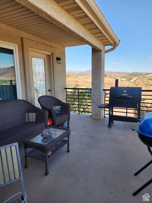 804 W Obsidian Dr S, St George, UT 84770 - view of patio / terrace with grilling area, a balcony, and a mountain view