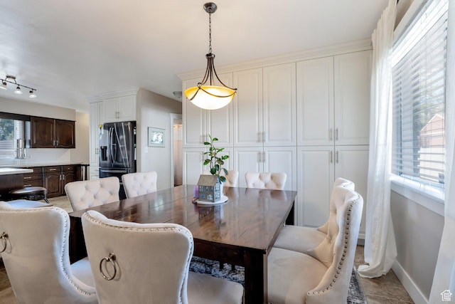 dining room featuring baseboards