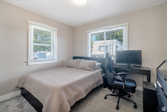 carpeted bedroom with baseboards