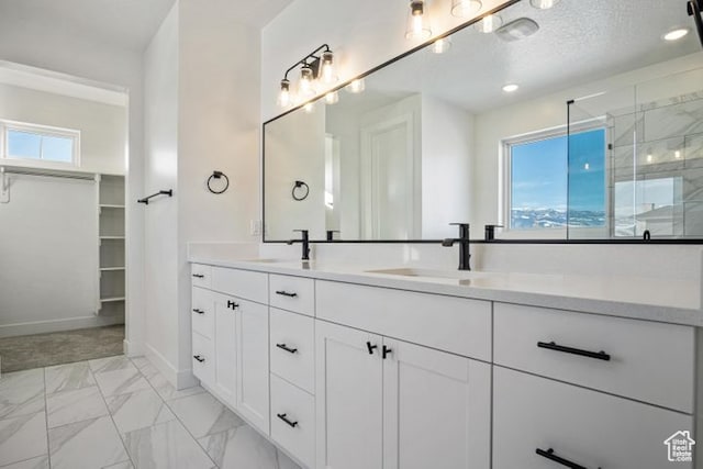 2390 W 5190 N Unit 4, Cedar City, UT 84721 - bathroom with an enclosed shower, vanity, and a textured ceiling