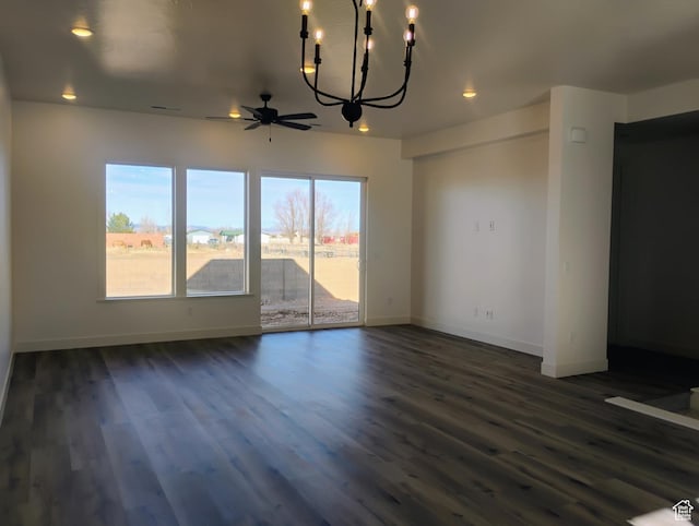 2390 W 5190 N Unit 4, Cedar City, UT 84721 - unfurnished dining area featuring ceiling fan with notable chandelier and dark wood-type flooring