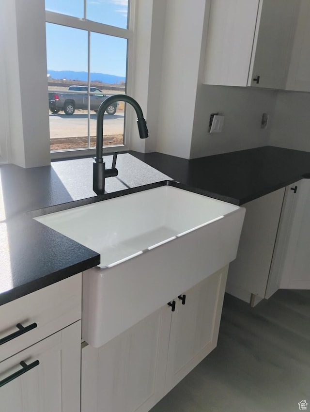 2390 W 5190 N Unit 4, Cedar City, UT 84721 - kitchen with white cabinetry, a mountain view, and sink