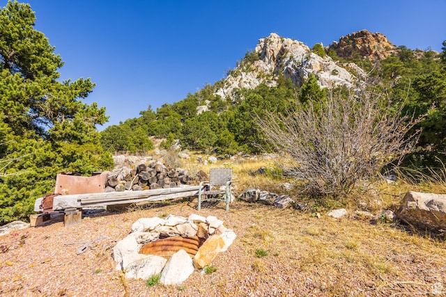 18906 N Canyon Rd, Whiterocks, UT 84085 - view of yard featuring a mountain view and a fire pit