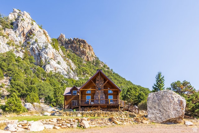 18906 N Canyon Rd, Whiterocks, UT 84085 - view of front of house featuring a deck with mountain view