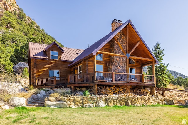 18906 N Canyon Rd, Whiterocks, UT 84085 - back of house featuring a deck and a yard