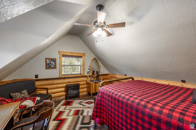 18906 N Canyon Rd, Whiterocks, UT 84085 - bedroom with ceiling fan, a textured ceiling, vaulted ceiling, a wood stove, and log walls