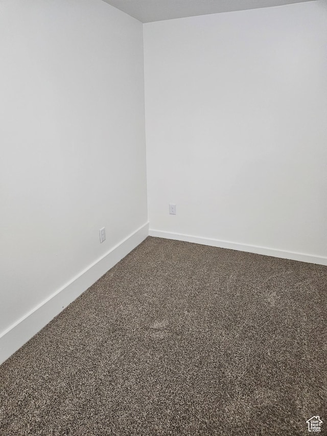 551 E Commonwealth Ave, Salt Lake City, UT 84106 - spare room featuring dark carpet and baseboards