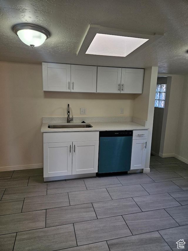 551 E Commonwealth Ave, Salt Lake City, UT 84106 - kitchen with dishwasher, a sink, a textured ceiling, and wood finish floors
