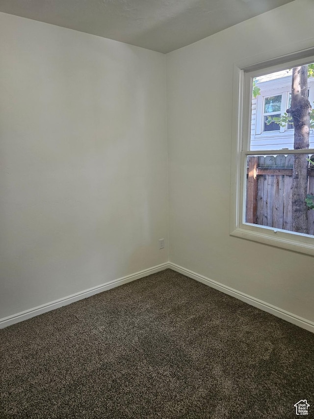 551 E Commonwealth Ave, Salt Lake City, UT 84106 - carpeted empty room with baseboards