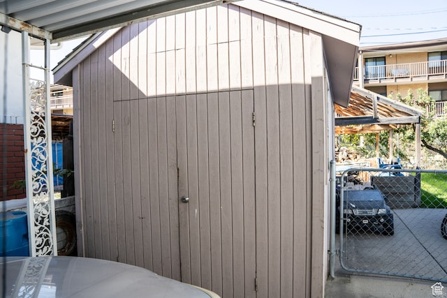 view of shed with fence