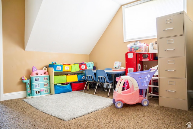 game room with carpet floors and vaulted ceiling