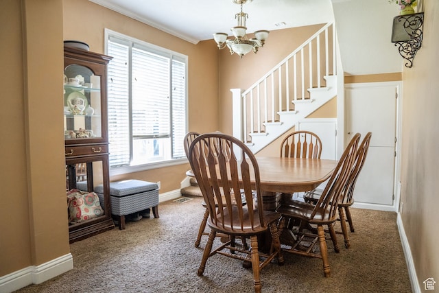 carpeted dining space featuring baseboards, a chandelier, a healthy amount of sunlight, and stairway