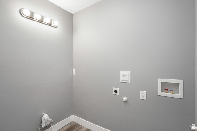 washroom featuring laundry area, wood finished floors, baseboards, electric dryer hookup, and washer hookup