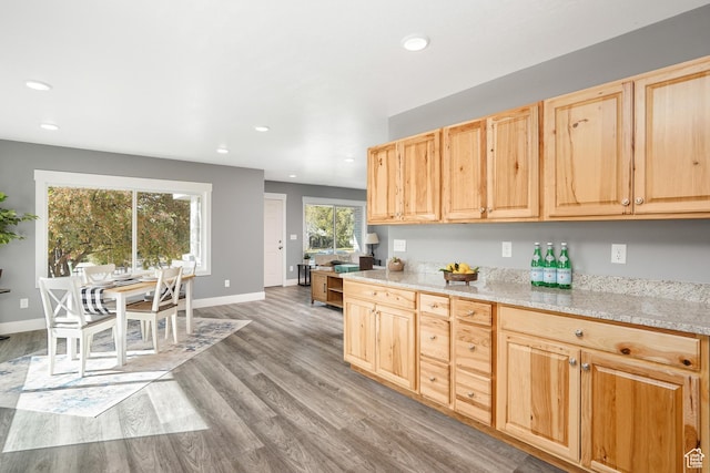kitchen featuring light wood-type flooring, light brown cabinetry, and recessed lighting