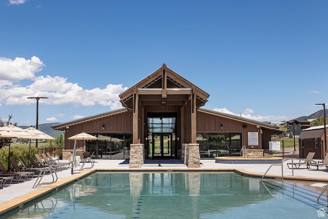 view of swimming pool with a patio area
