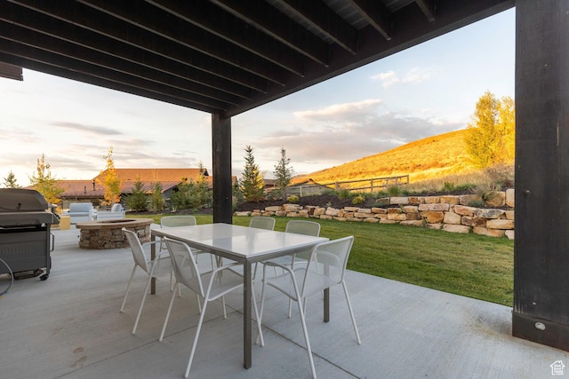 498 Thorn Creek Dr, Kamas, UT 84036 - patio terrace at dusk with outdoor dining area, a patio area, and grilling area