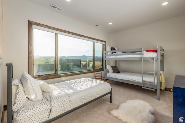 carpeted bedroom featuring a mountain view
