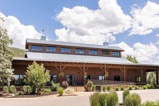 498 Thorn Creek Dr, Kamas, UT 84036 - view of front facade featuring a chimney, board and batten siding, and a metal roof