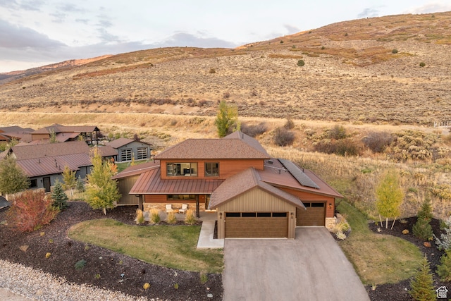 drone / aerial view featuring a mountain view