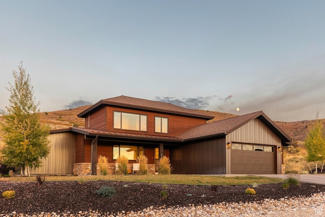 498 Thorn Creek Dr, Kamas, UT 84036 - view of front of house with an attached garage, covered porch, driveway, and stone siding