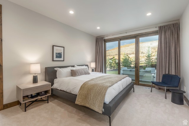 carpeted bedroom with access to exterior