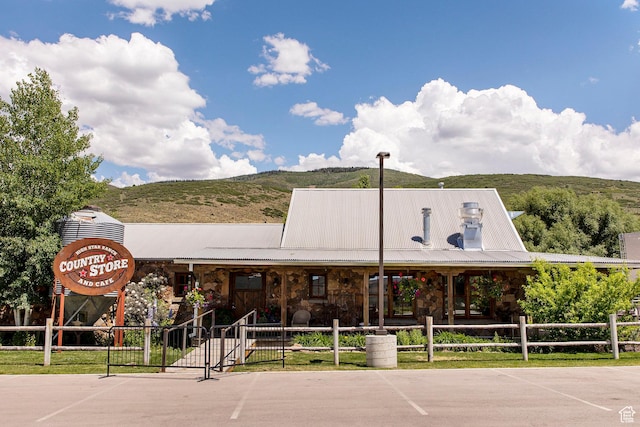 498 Thorn Creek Dr, Kamas, UT 84036 - view of building exterior with uncovered parking and a mountain view