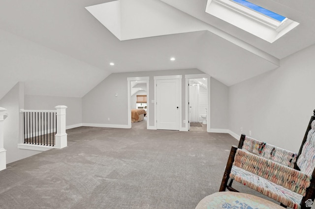 170 E 3900 N, North Ogden, UT 84414 - living area featuring a skylight, lofted ceiling, carpet floors, baseboards, and an upstairs landing