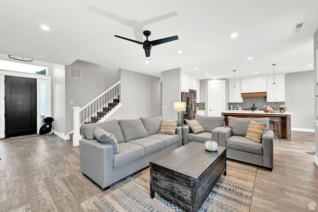 170 E 3900 N, North Ogden, UT 84414 - living area with light wood-style flooring, a ceiling fan, stairway, recessed lighting, and baseboards