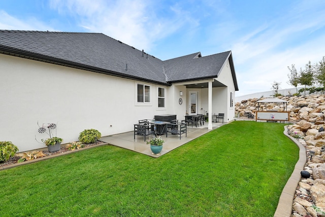 170 E 3900 N, North Ogden, UT 84414 - back of house featuring stucco siding, a patio, roof with shingles, and a lawn