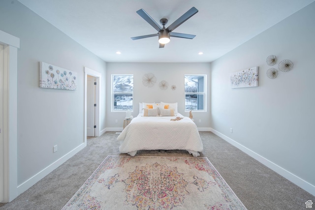 carpeted bedroom with ceiling fan