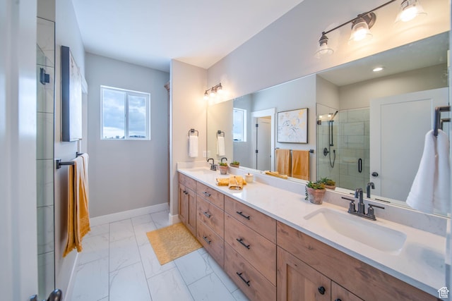 bathroom with vanity and a shower with shower door