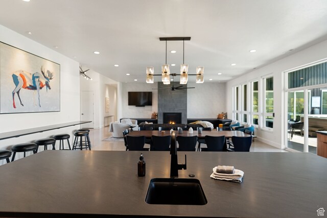 70 W 350 S, Garden City, UT 84028 - dining area featuring sink, a fireplace, and an inviting chandelier