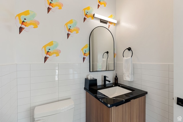 70 W 350 S, Garden City, UT 84028 - bathroom featuring vanity, toilet, and tile walls