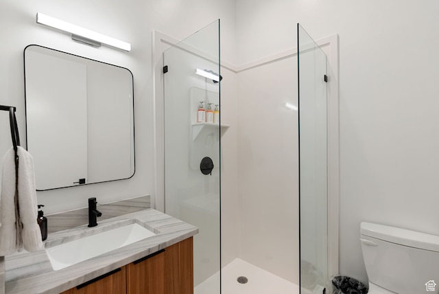 70 W 350 S, Garden City, UT 84028 - bathroom featuring vanity, toilet, and an enclosed shower
