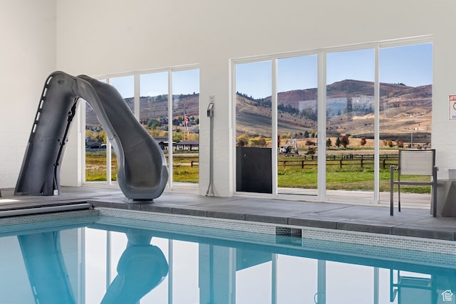 70 W 350 S, Garden City, UT 84028 - view of swimming pool featuring a water slide, a hot tub, and a mountain view