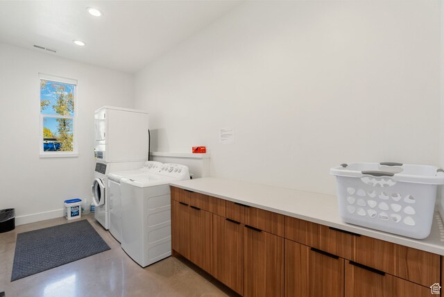 70 W 350 S, Garden City, UT 84028 - laundry room featuring stacked washer and clothes dryer and cabinets