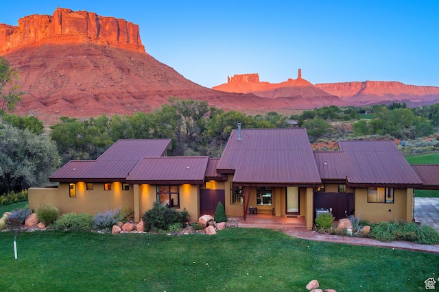 425 Amber Ln, Castle Valley, UT 84532 - view of front of property featuring a mountain view and a front lawn
