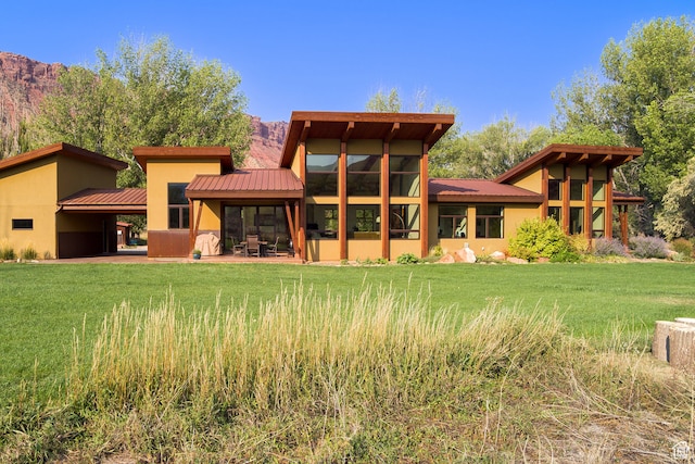 425 Amber Ln, Castle Valley, UT 84532 - rear view of house featuring a lawn
