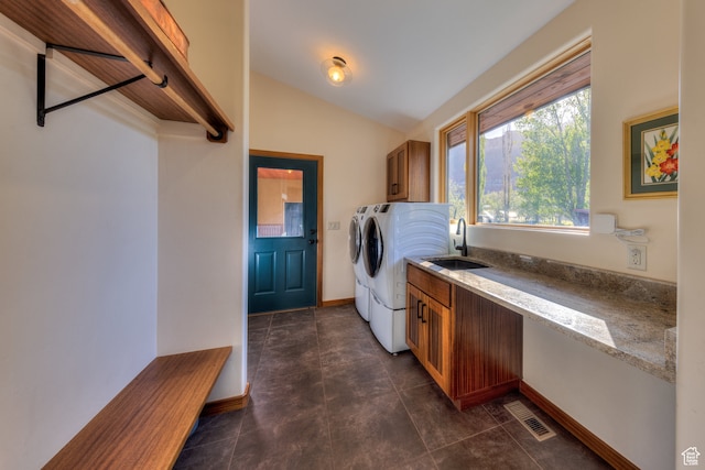 425 Amber Ln, Castle Valley, UT 84532 - laundry room featuring sink, cabinets, washing machine and clothes dryer, and dark tile patterned floors